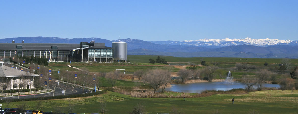 View of campus from distant with snow capped Sierra's in the distance